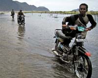 Floods kill at least 14 in Indonesia, three missing: official