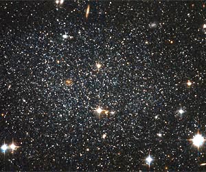 Antlia Dwarf Galaxy Peppers the Sky with Stars