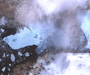 Giant ice island breaks in two