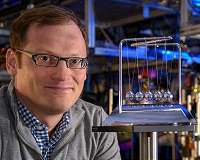 Toy-inspired experiment on behavior of quantum systems