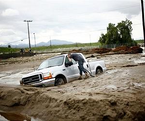 California cleans up after deluge, more feared