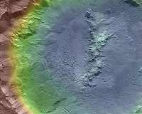 Pitted Materials in Craters Could Indicate Buried Ice on Asteroids