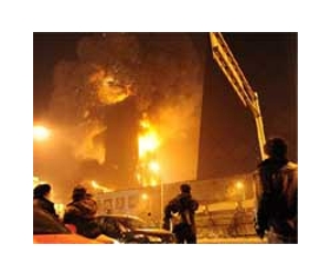 China holds 71 responsible for state TV station fire tragedy