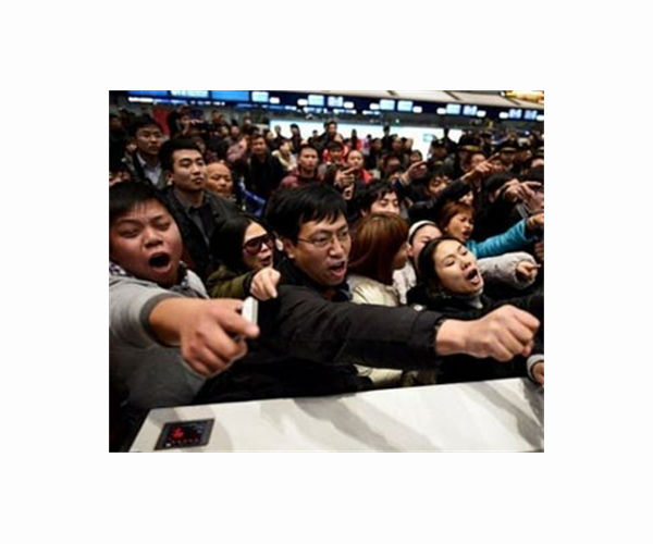 Chinese endure New Year travel rush for a taste of home