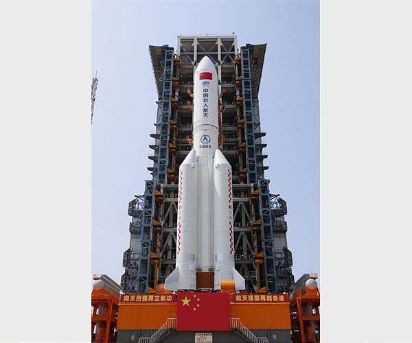 Rocket to lift space station core moves to launch tower