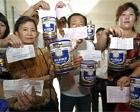 China couple first to take milk payout: state media