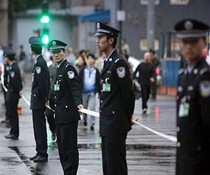 Police, rioters clash in China over land: reports