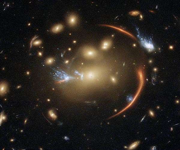 Hubble views a faraway galaxy through a cosmic lens