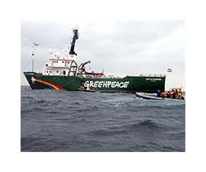 Russia tows Greenpeace ship to port, activists risk charges