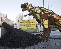 Greenpeace goes prehistoric to protest coal-fired plant in Germany