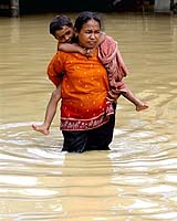 Indonesian Flood Victims Still In Camps As Homes Buried In Mud