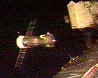 Russian ship with tourist docks with space station