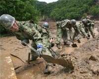 Japan troops search mud as quake toll hits 10