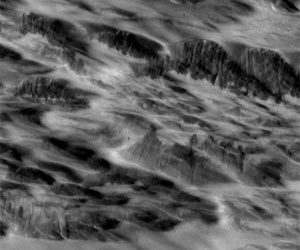 Meteorite Shock Waves Trigger Dust Avalanches on Mars