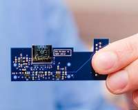 Engineers shrink microscope to dime-sized device