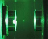 Nanospheres cooled with light to explore the limits of quantum physics