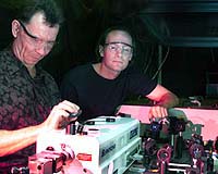 Pumping Energy To Nanocrystals From A Quantum Well
