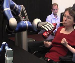 Paralyzed individuals use thought-controlled robotic arm to reach and grasp