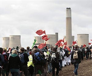 Britain pledges to halve CO2 output