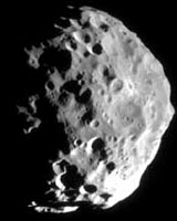 Uncovering The Secrets Of Saturn's Mysterious Black Moon