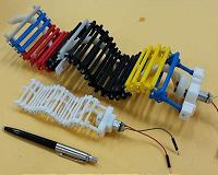First wave-propelled robot swims, crawls and climbs using a single, small motor