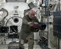 US astronaut misses fresh air halfway through year-long mission