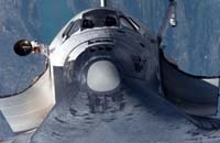 Shuttle Discovery heads home after ambitious, risky mission