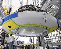 Heat shield install brings Orion spacecraft closer to space