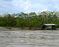 Rooftop refugees plead for water in flooded Peru city