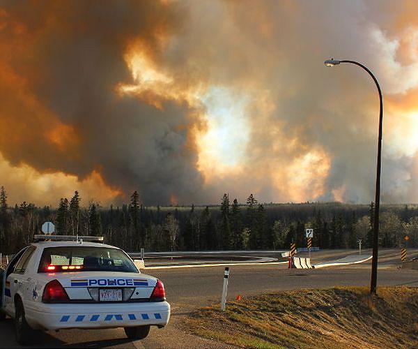 Wildfires abate slowly in western Canada