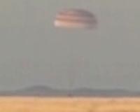 Russian, North American astronauts return to earth