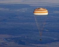 Two Russians, one American land back on Earth from ISS