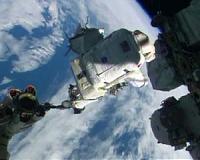 Long haul, night repairs for British, US spacewalkers
