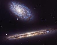 A New Angle on Two Spiral Galaxies for Hubble's 27th Birthday