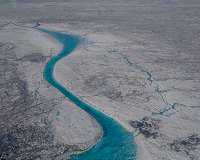 Microbes on ice sheets produce bioreactive carbon that is exported to downstream ecosystems
