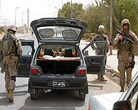 Marines manning checkpoints receiving attention-getter