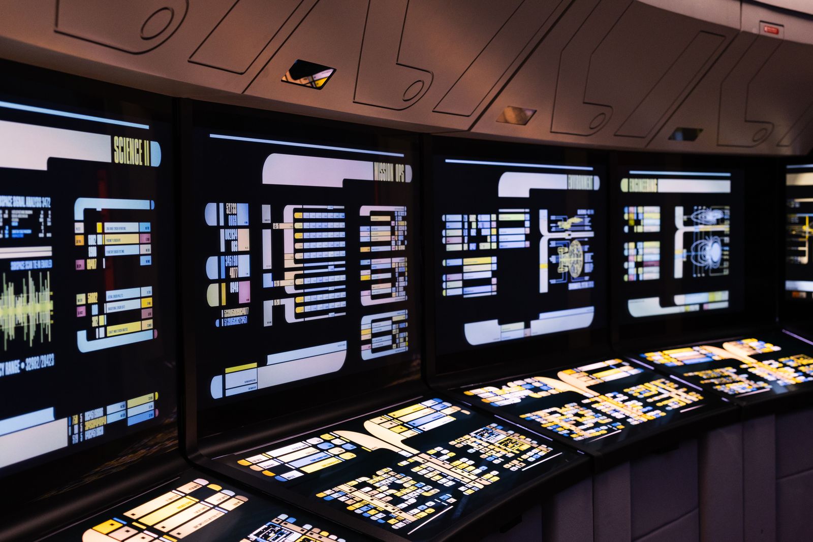 Margaret Hamilton's Apollo 11 flight software threw a 1202 alarm three minutes before Armstrong landed, and the priority-scheduling logic she had insisted on including let the guidance computer drop lower tasks and keep flying while a radar switch flooded it with data