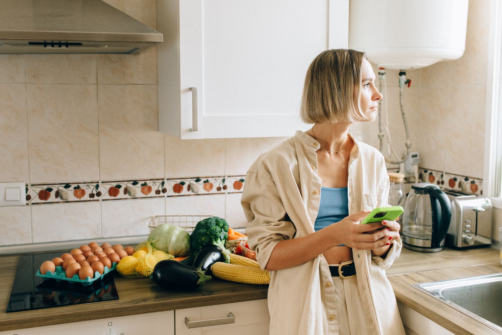 woman alone kitchen