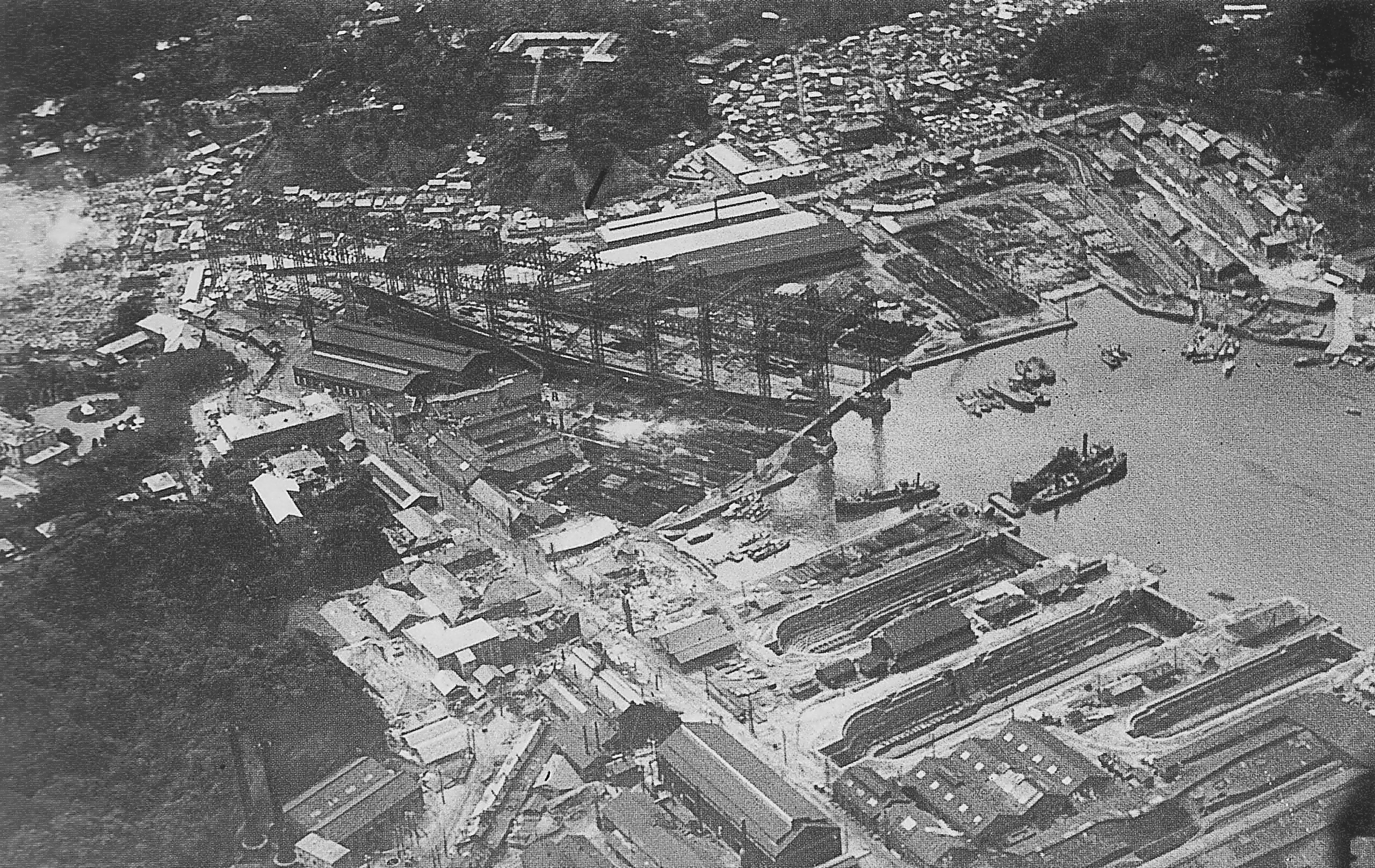 Days after the Great Kantō Earthquake of September 1923, aerial photos showed Yokosuka Naval Arsenal wrecked and the battlecruiser Amagi sitting damaged on the building berth
